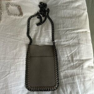Never used- Cross Body phone case with pocket on 1 side